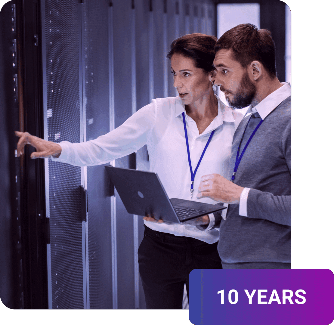 Two people discussing data center servers.